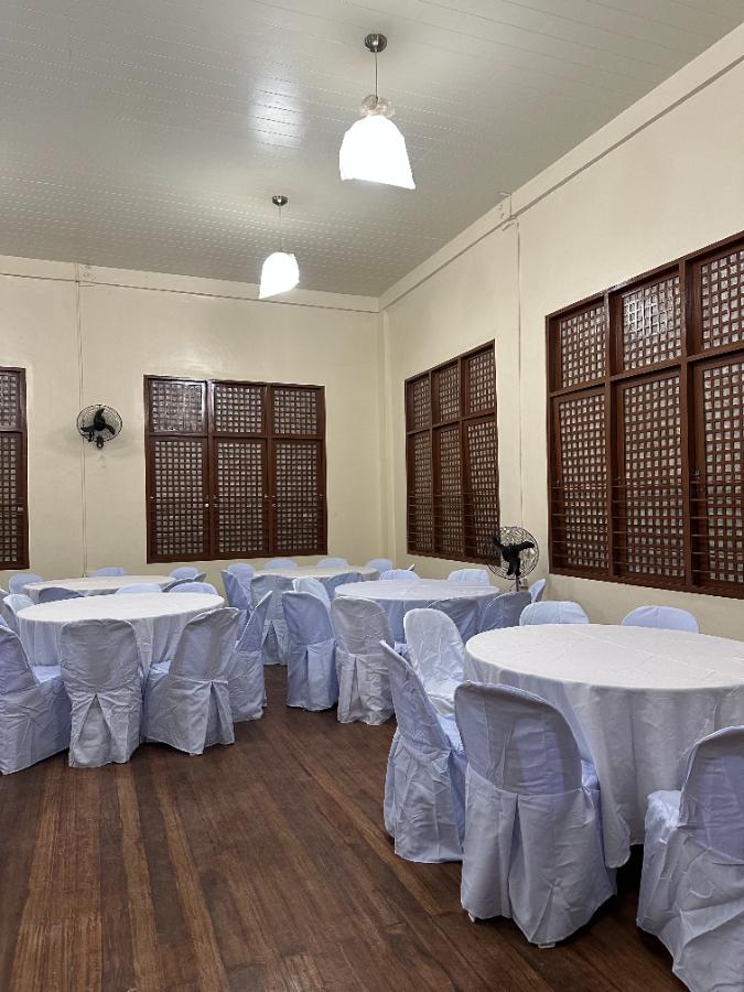 Heritage hall · white round tables — event rental setup by Chairman Event Rentals in Laguna