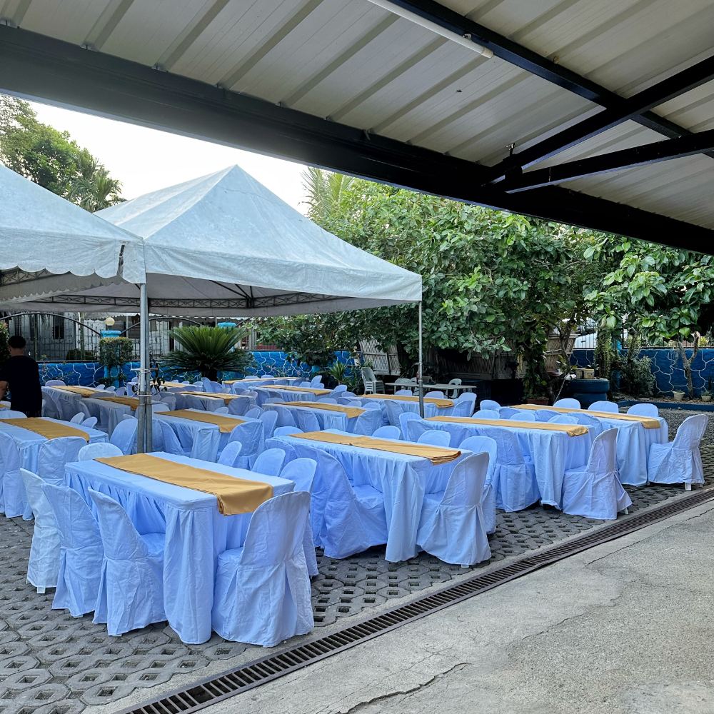 6ft long table rental with white cover and gold runner